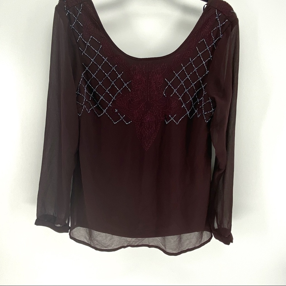 BKE Boutique red blouse with grey beading